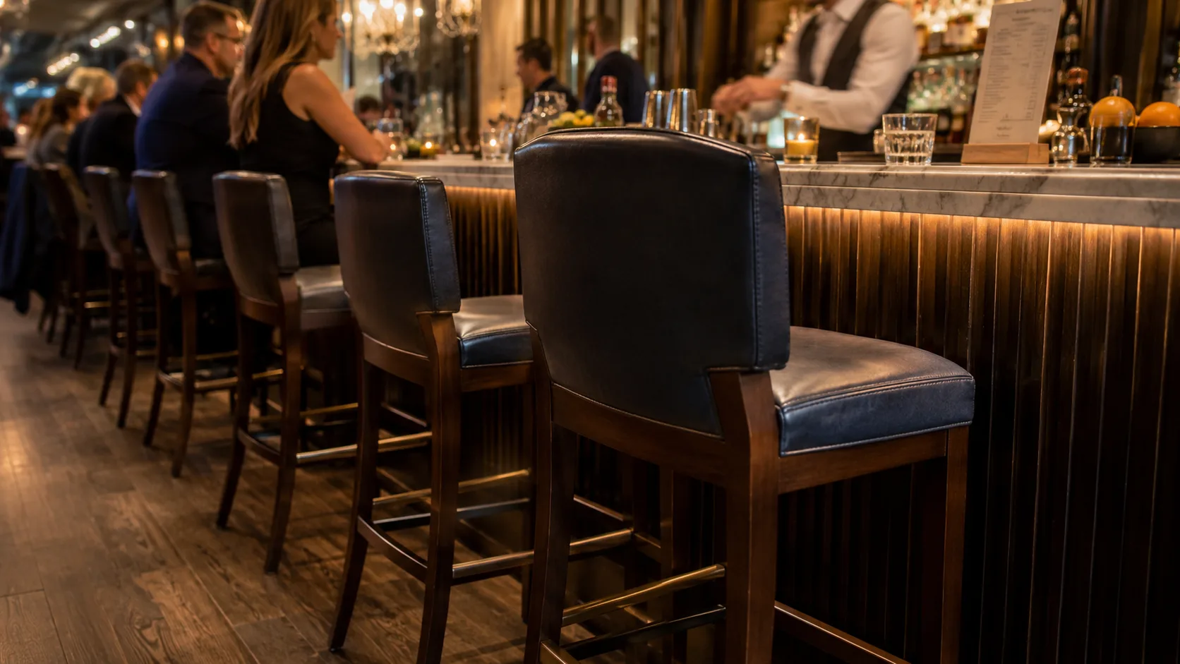 Restaurant bar barstools in active service during busy service