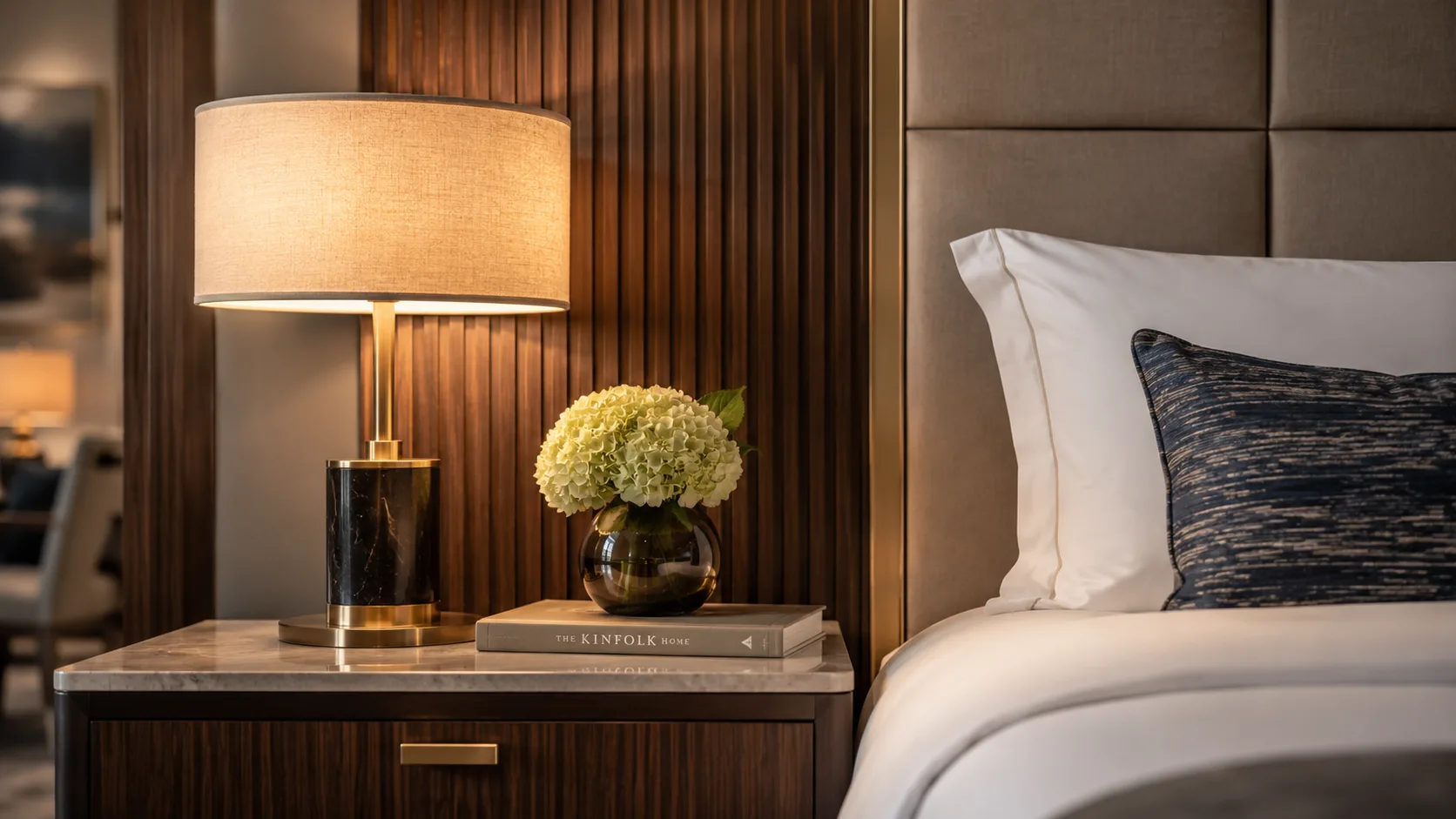 Hotel room nightstand furniture detail showing contract-grade construction and finish