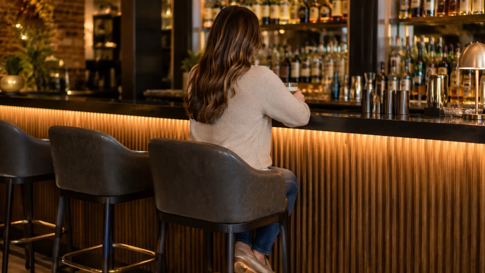 Correct barstool height seated comfort showing proper ergonomic positioning at bar