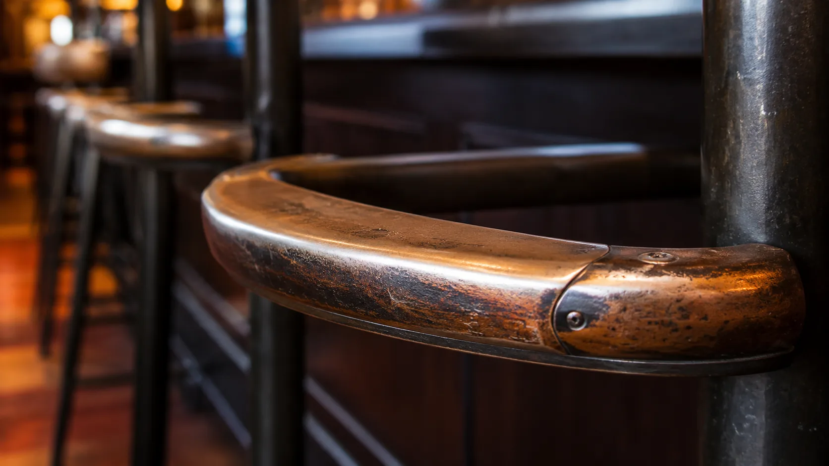 Bar height table detail with cast iron base and standing service area
