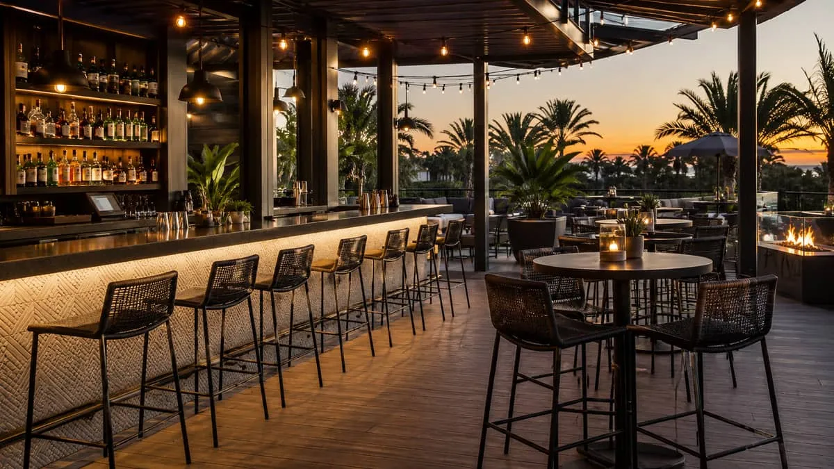 Outdoor rooftop bar furniture with rattan stools showing outdoor commercial seating spec