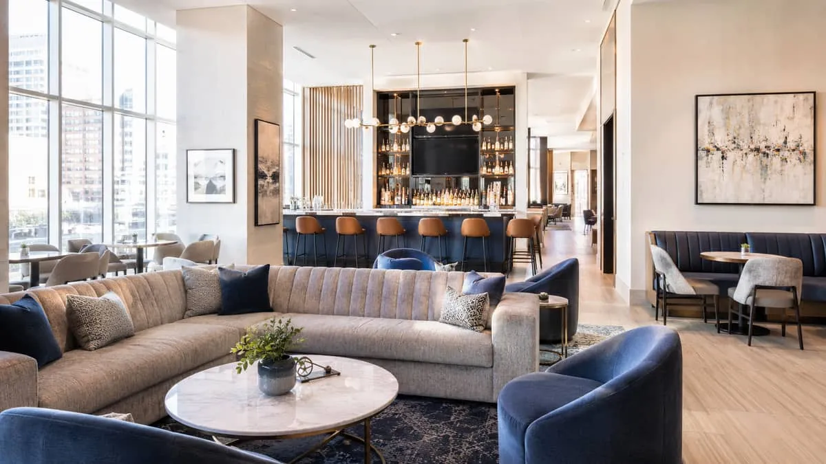 finished Calgary restaurant or hotel lounge interior with contract furniture in place, warm lighting, visible quality in
