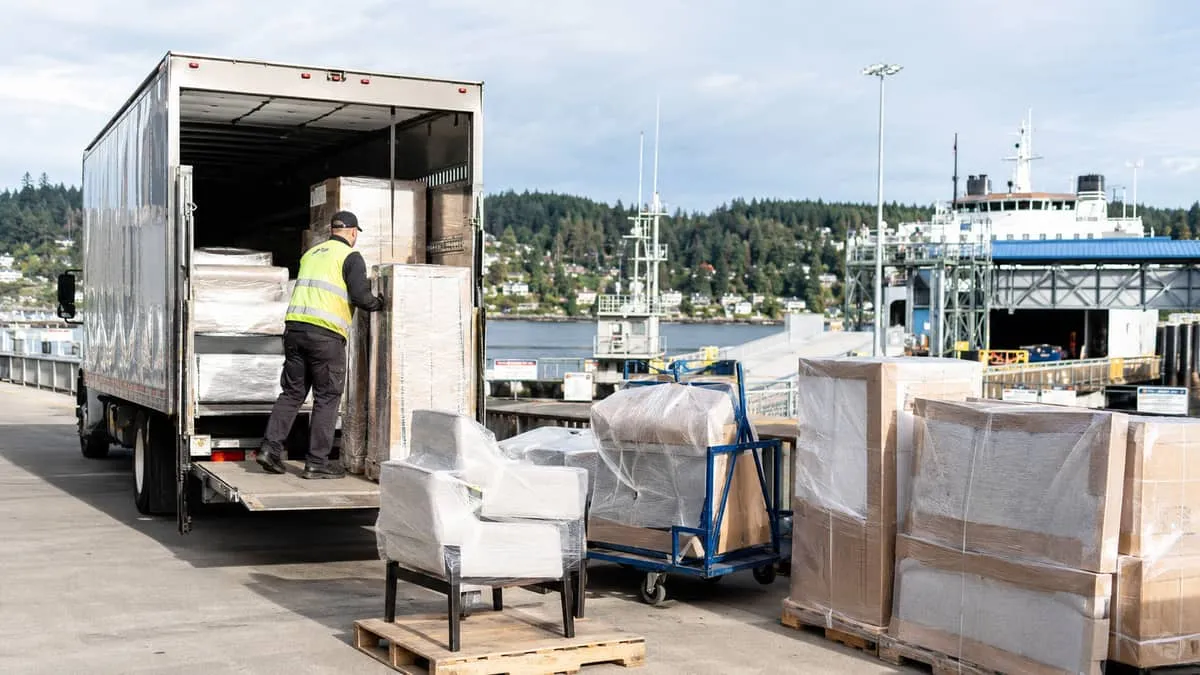 a delivery truck or freight staging area near the BC Ferries terminal or a Victoria warehouse dock, showing hospitality 