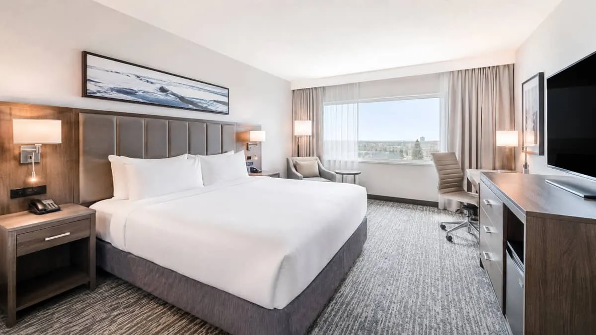 finished Winnipeg hotel room after furniture installation, showing a complete guest room setup with casegoods, upholster