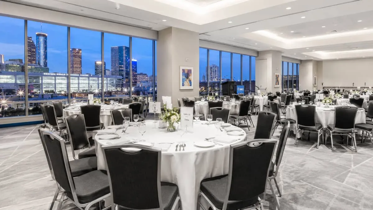 Banquet event chairs set up in rows for a large venue booking