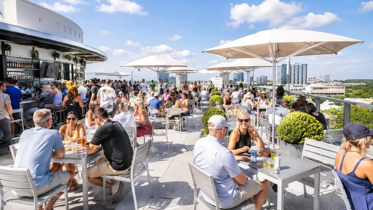 Commercial patio furniture installation complete at Atlanta Midtown rooftop bar showing full outdoor seating program ready for Georgia summer season