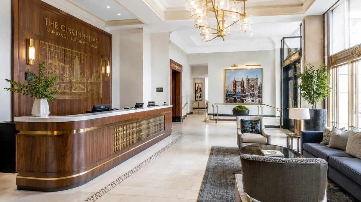 Little Rock hotel lobby chair with moisture-resistant performance upholstery and solid hardwood frame showing commercial construction detail for humid Arkansas climate